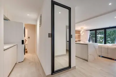a large mirror in a living room of a house at Seaside Hideaway Walk to Playa Flamingo Marina in Playa Flamingo