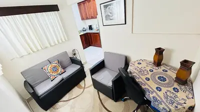a living room with a couch and a table at Apartamento San Juan in Santa Bárbaraa