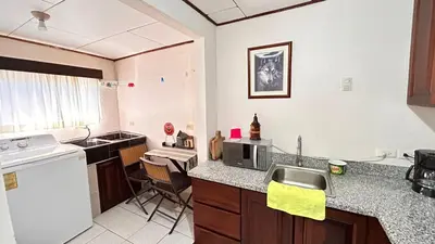 a kitchen with a sink and a counter top at Apartamento San Juan in Santa Bárbaraa