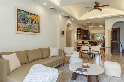 a living room with a couch and a table at Matapalo 202-Poolside Condo at Tamarindo in Tamarindo