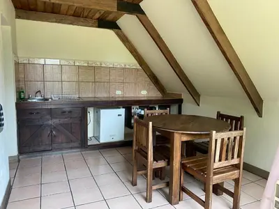 a kitchen with a table and chairs in a room at Villa Calas in Vara Blanca