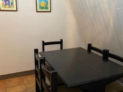 a black dining table and chairs in a room at Villa Calas in Vara Blanca
