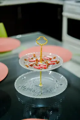 a glass plate with candy canes on a table at Toscana Escazú in San Rafael