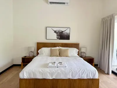 a bedroom with a bed with two towels on it at Luxury Beachfront in Playa Tivives, Puntarenas with Ocean Views,Pool in Tivives
