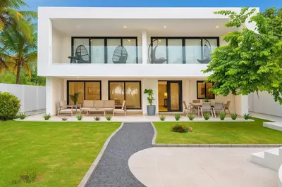 a bedroom villa with a view of the garden at Luxury Beachfront in Playa Tivives, Puntarenas with Ocean Views,Pool in Tivives
