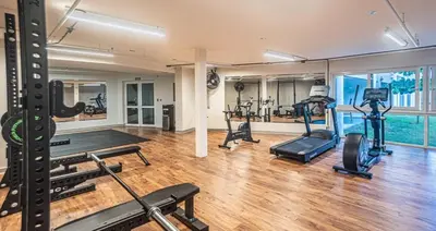 a gym with several treadmills and exercise bikes at Pacific Point - Pure Vida in Jaco, Costa Rica in Jacó