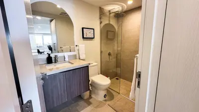a bathroom with a toilet and a sink and a shower at Pacific Point - Pure Vida in Jaco, Costa Rica in Jacó