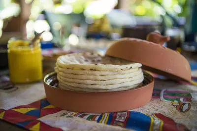 a pile of crackers in a bowl on a table at Casa Alma, Nature Escape with River, Trails and Views