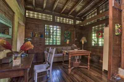 a living room with a table and a couch at Casa Alma, Nature Escape with River, Trails and Views