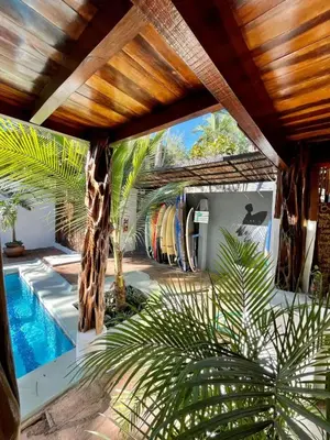 a house with a swimming pool with a giraffe at La Buena vida Cabina 2 in Refundores