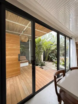 a room with a sliding glass door to a patio at Calalun in Fortuna