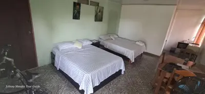 a room with two beds in a room at Mountain Retreat in Bijagua de Upala with Stunning Nature Views in Bijagua