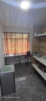 a room with a table and a window in it at Mountain Retreat in Bijagua de Upala with Stunning Nature Views in Bijagua