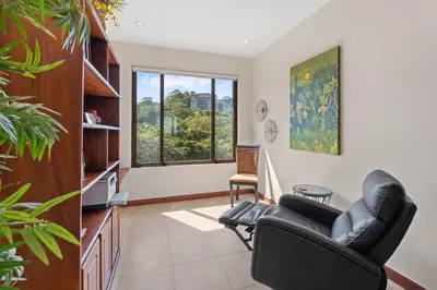 a living room with a couch and a chair at Treetop Ocean View Penthouse - Jobo 15 in Playa Conchal
