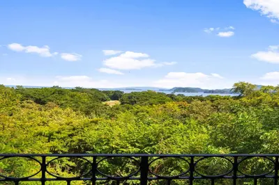 a view of the forest from a balcony at Treetop Ocean View Penthouse - Jobo 15 in Playa Conchal