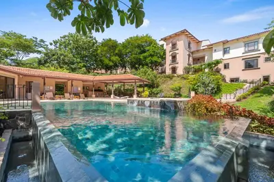 an image of a swimming pool in a house at Treetop Ocean View Penthouse - Jobo 15 in Playa Conchal