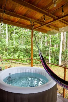 a hot tub in a hammock in the woods at Villa Azul-Colibrí, Río Celeste in Rio Celeste