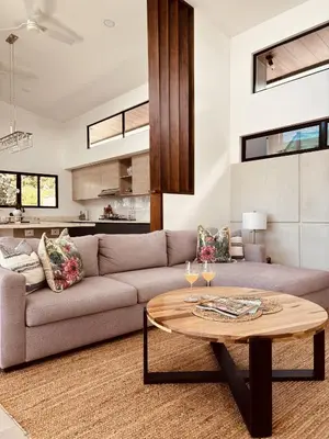 a living room with a couch and a table at Casa Celeste in Uvita