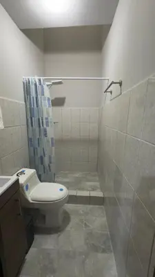 a bathroom with a toilet and a shower at Central and comfortable mini apartment in San Sebastian in San José