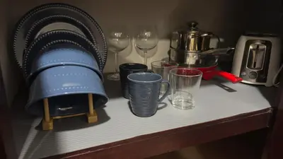 a table with wine glasses and a coffee maker at Central and comfortable mini apartment in San Sebastian in San José