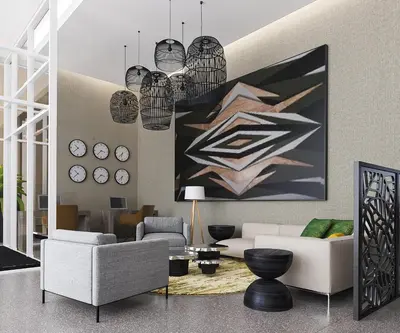 a living room with two couches and a painting at Hyatt Place Cariari/Convention Center in San José