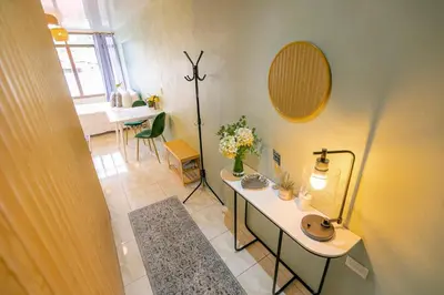 a bathroom with a sink and a table with a mirror at Lovely Loft with volcan view La Fortuna Downtown in Fortuna
