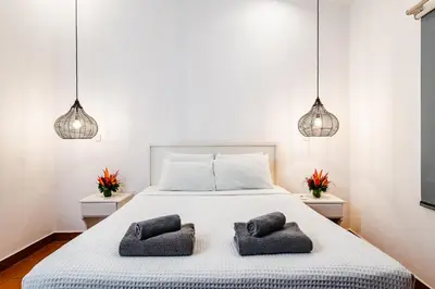 a bedroom with a bed with two pillows on it at Hotel Gardenia Tamarindo in Tamarindo