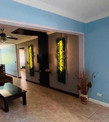 a living room with a couch and a table at Apartments for vacation by the Pasifc in Coco