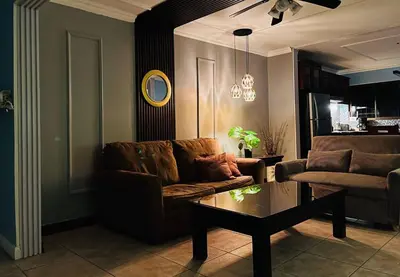 a living room with a couch and a coffee table at Apartments for vacation by the Pasifc in Coco