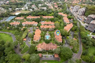 an aerial view of a large estate with houses at Elegant Condo in High-End Resort Community with Pool and Beach Club Access in Coco