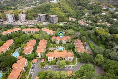 an aerial view of a mansion with a lot of houses at Elegant Condo in High-End Resort Community with Pool and Beach Club Access in Coco