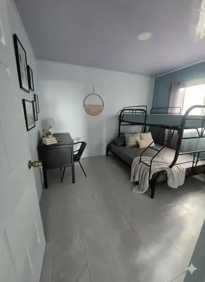 a room with two bunk beds and a table at Uvita, Bahía Ballena, Ocean View in Uvita