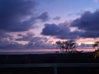 a view of a sunset from the balcony of a house at Uvita, Bahía Ballena, Ocean View in Uvita