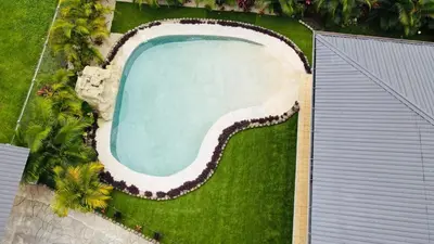 an overhead view of a swimming pool on a lawn at Gray Oasis, Private Pool in Agua Azul