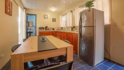 a large kitchen with a stainless steel refrigerator at Fortuna Flat Walk & Value in Fortuna