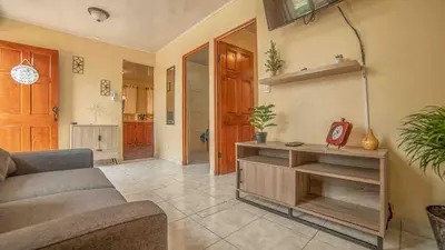 a living room with a couch and a table at Fortuna Flat Walk & Value in Fortuna
