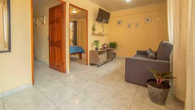 a living room with a couch and a table at Fortuna Flat Walk & Value in Fortuna