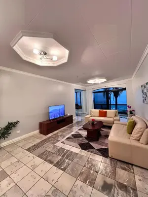 a living room with a couch and a tv at Casa Escazu Overlook in San Antonio