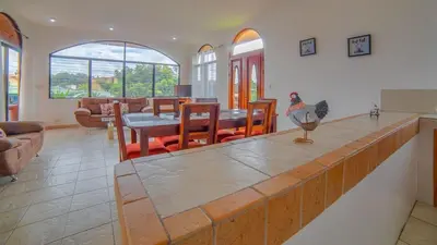 a kitchen and living room with a chicken on a counter at Oasis 17 , Group Getaway in Fortuna