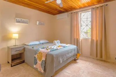 a childs bedroom with a bed and a window at Oasis 17 , Group Getaway in Fortuna