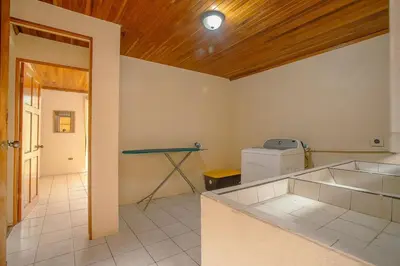 a kitchen with a counter and a table in a room at Oasis 17 , Group Getaway in Fortuna