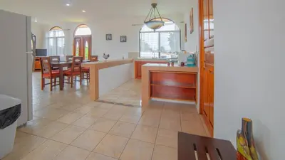 a kitchen and dining room with a table and chairs at Oasis 17 , Group Getaway in Fortuna