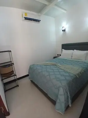a bedroom with a bed and a ladder in it at Loft en San José de pinilla avellanas guanacaste in San José Pinilla