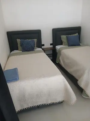 two beds sitting next to each other in a room at Loft en San José de pinilla avellanas guanacaste in San José Pinilla