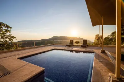 a swimming pool on the roof of a house at Luxury Villa Bijagual Costa Rica in Carara