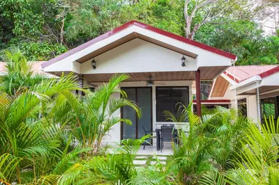 a small house with a red roof at Nosara Beach Cabins in Nicoya