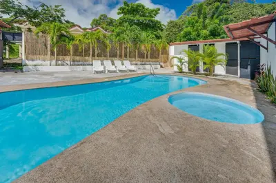 a swimming pool in the backyard of a house at Casa Luna in Carpintero