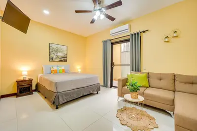 a bedroom with a bed and a couch at Casa Luna in Carpintero