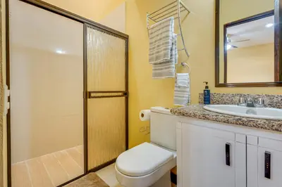 a bathroom with a toilet and a sink and a shower at Casa Luna in Carpintero