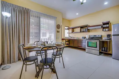 a kitchen and dining room with a table and chairs at Casa Luna in Carpintero